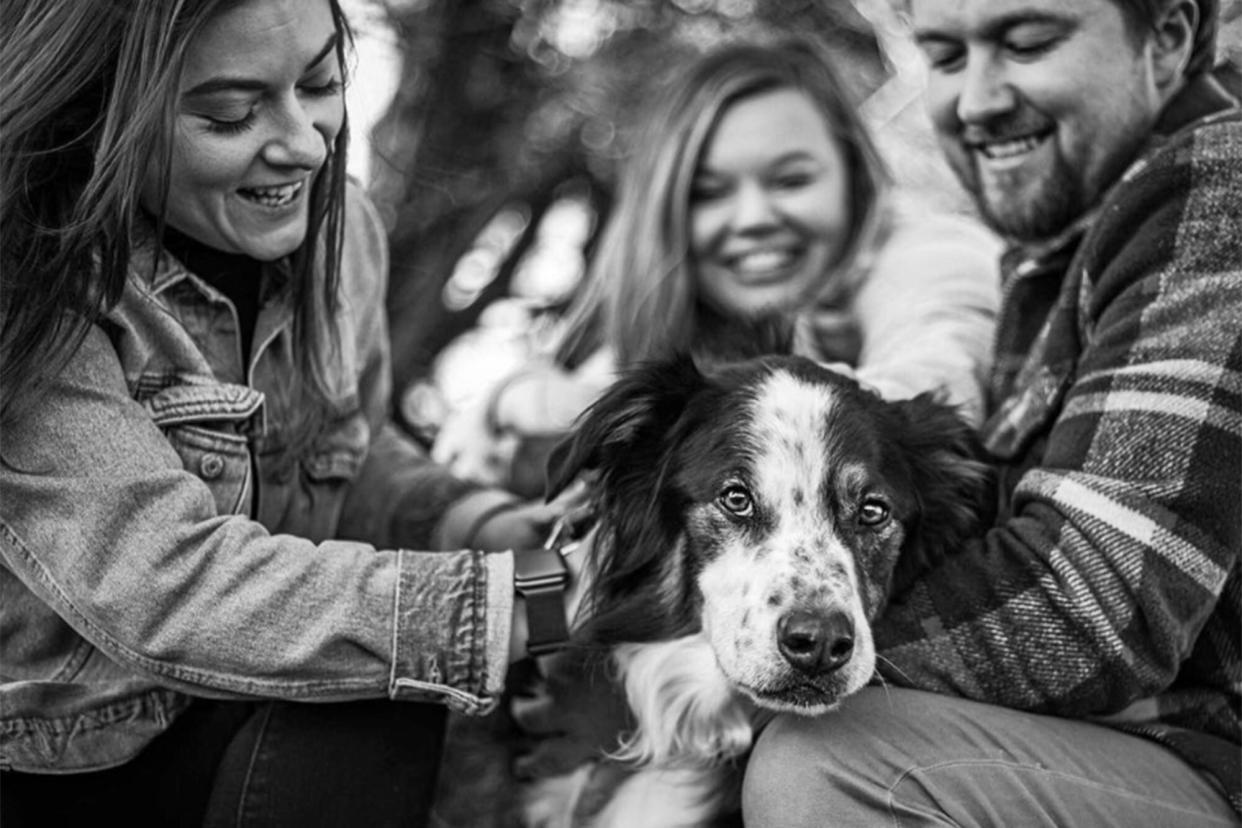 end of life photography; black and white photo of family with their dog