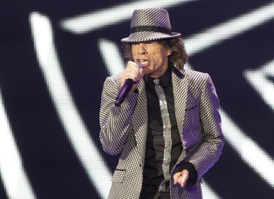 Mick Jagger of The Rolling Stones performs at the O2 arena in east London, Sunday, Nov. 25, 2012. The band are playing four gigs to celebrate their 50th anniversary, including two shows at London’s O2 and two more in New York. (Photo by Joel Ryan/Invision/AP)