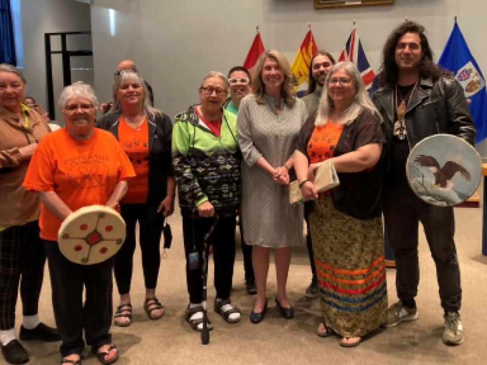 Fredericton mayor Kate Rogers, centre, at the announcement the Wolastoqey immersion school would gain access to Killarney Park. The immersion school is set to open in the fall.  (City of Fredericton  - image credit)