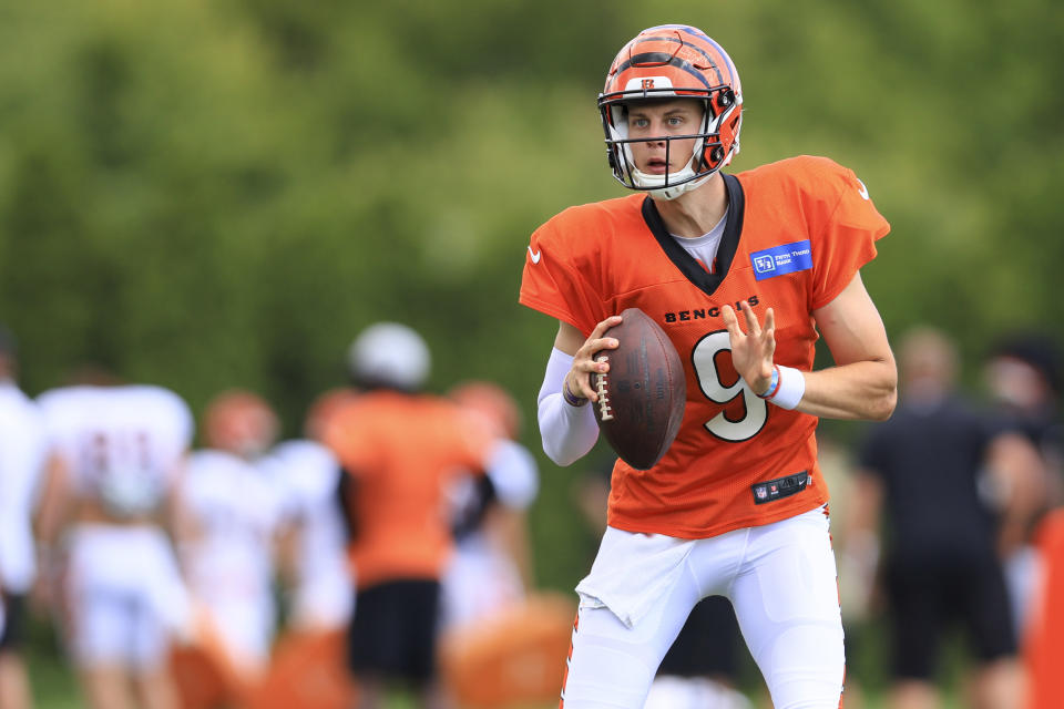 Cincinnati Bengals quarteraback Joe Burrow looks to pass during NFL football training camp in Cincinnati, Monday, Aug. 15, 2022. (AP Photo/Aaron Doster)