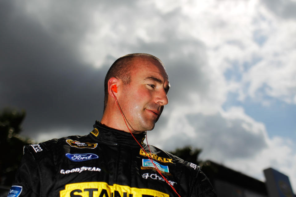 DAYTONA BEACH, FL - FEBRUARY 19: Marcos Ambrose, driver of the #9 Stanley Ford, looks on after qualifying for the NASCAR Sprint Cup Series Daytona 500 at Daytona International Speedway on February 19, 2012 in Daytona Beach, Florida. (Photo by Tom Pennington/Getty Images for NASCAR)