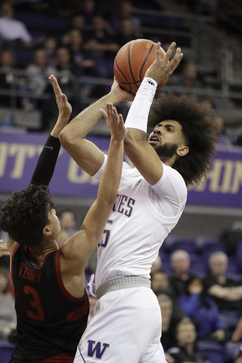 Washington's Marcus Tsohonis shoots over Stanford's Tyrell Terry (3) during the first half of an NCAA college basketball game Thursday, Feb. 20, 2020, in Seattle. (AP Photo/Elaine Thompson)
