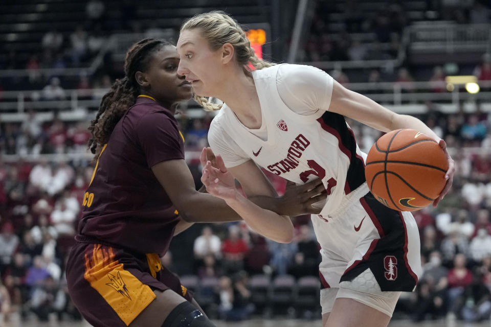Stanford forward Cameron Brink, right, drives to the basket against Arizona State forward Sandra Magolico during the first half of an NCAA college basketball game in Stanford, Calif., Sunday, Feb. 25, 2024. (AP Photo/Jeff Chiu)