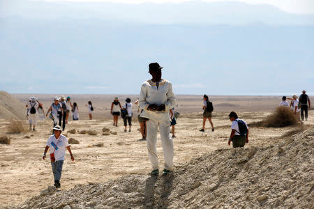 A man takes part in a march attended by thousands of Palestinian and Israeli women, as part of an event organised by "Women Wage Peace" group, calling for an end to the Israeli-Palestinian conflict, near the Jordan River, in the occupied West Bank October 8, 2017. REUTERS/Ronen Zvulun