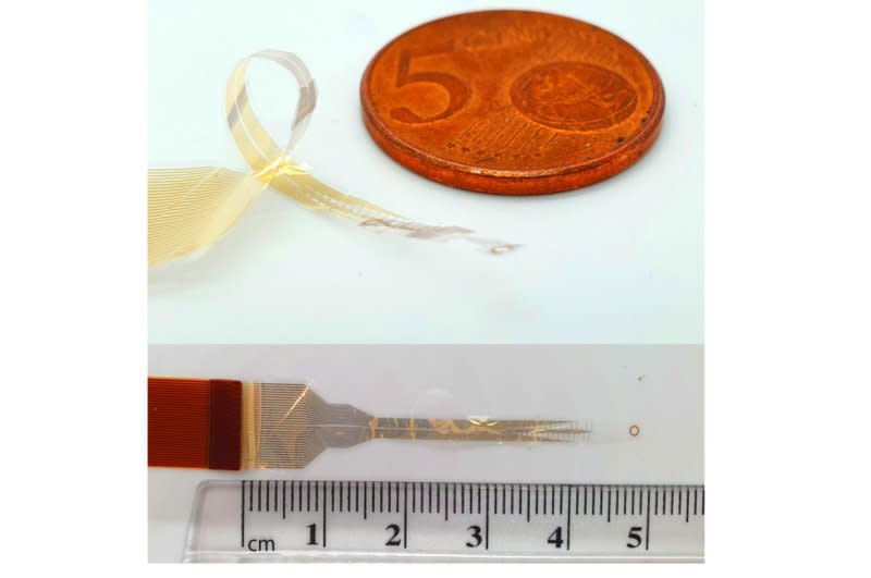 A tiny, flexible electronic device that wraps around the spinal cord could represent a new approach to the treatment of spinal injuries, which can cause profound disability and paralysis. Work on the device was performed by Researchers at Cambridge University in England. Photo courtesy Cambridge University