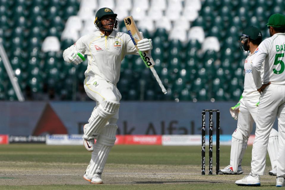 Usman Khawaja, pictured here celebrating after scoring a century in the third Test against Pakistan.