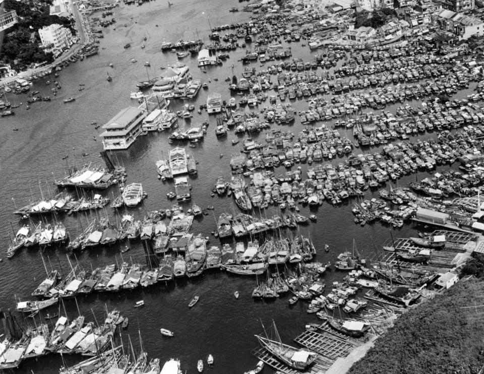 An aerial view of Aberdeen Harbor with rows of boats in a line.