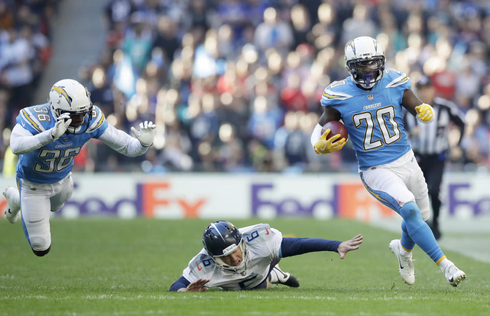 <p>Los Angeles Chargers defensive back Desmond King (20) runs with the ball during the first half of an NFL football game against Tennessee Titans at Wembley stadium in London, Sunday, Oct. 21, 2018. (AP Photo/Matt Dunham) </p>