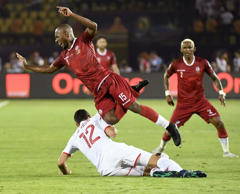 Madagascar midfielder Ibrahim Amada (L) leaps during a 2019 Africa Cup of Nations quarter-final against Tunisia in Cairo. (Khaled DESOUKI)