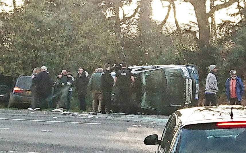 The crash site, with the Duke of Edinburgh at the centre wearing a green jacket - TELEGRAPH EXCLUSIVE