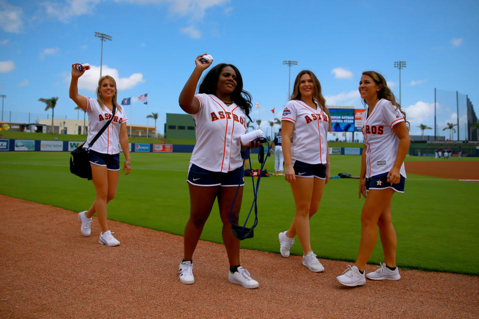 <p>Members of the Astros fan patrol are on hand to throw T-shirts to fans before the baseball game between the Minnesota Twins and the Houston Astros at the Ballpark of the Palm Beaches in West Palm Beach, Fla., on Feb. 28, 2018. (Photo: Gordon Donovan/Yahoo News) </p>