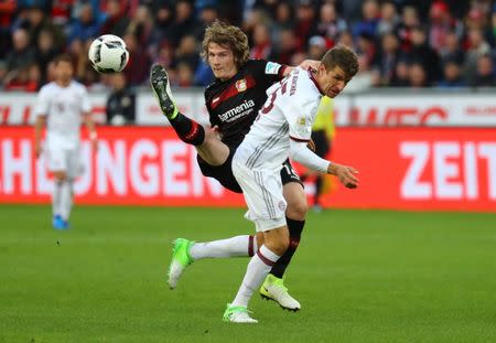 Soccer Football - Bayer Leverkusen vs Bayern Munich - Bundesliga - BayArena, Leverkusen, Germany - 15/4/17 Bayer Leverkusen's Tin Jedvaj in action with Bayern Munich's Thomas Muller Reuters / Kai Pfaffenbach Livepic