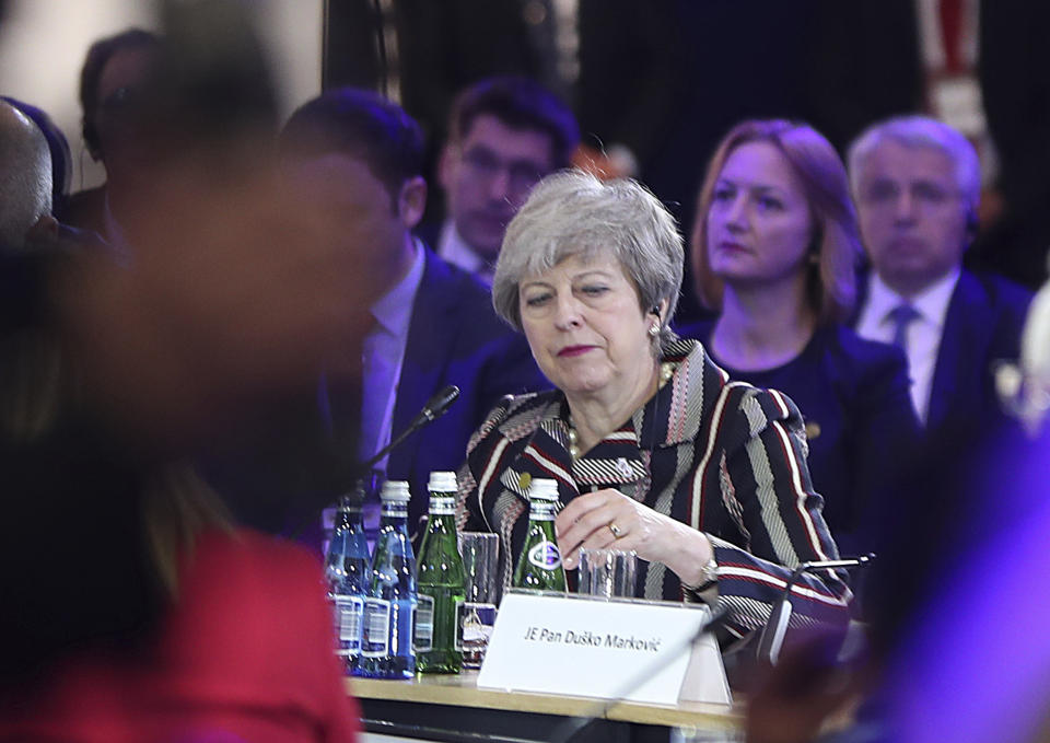 British Prime Minister Theresa May listening to a speech by Poland's President Andrzej Duda during a summit meeting that aims to reassure Western Balkan states that their aspirations to join the European Union have backing among EU leaders, in Poznan, Poland, Friday, July 5, 2019.(AP Photo/Czarek Sokolowski)