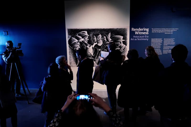 People attend the preview of "Rendering Witness" exhibition at the Museum of Jewish Heritage in the Manhattan borough of New York City