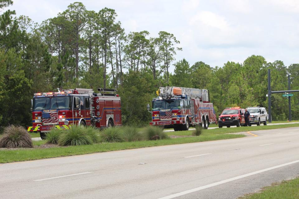 Palm Coast Fire Department trucks parked in a turn lane along State Road 100 as the Flagler County Sheriff's Office investigated a bomb threat at Flagler Technical College on Thursday.