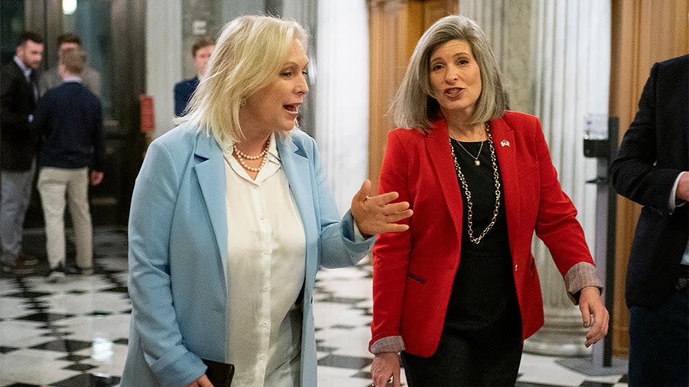 Sens. Kirsten Gillibrand (D-N.Y.) and Joni Ernst (R-Iowa) arrive for a vote for a short-term continuing resolution to fund the government until Feb 18 on Thursday, December 2, 2021.