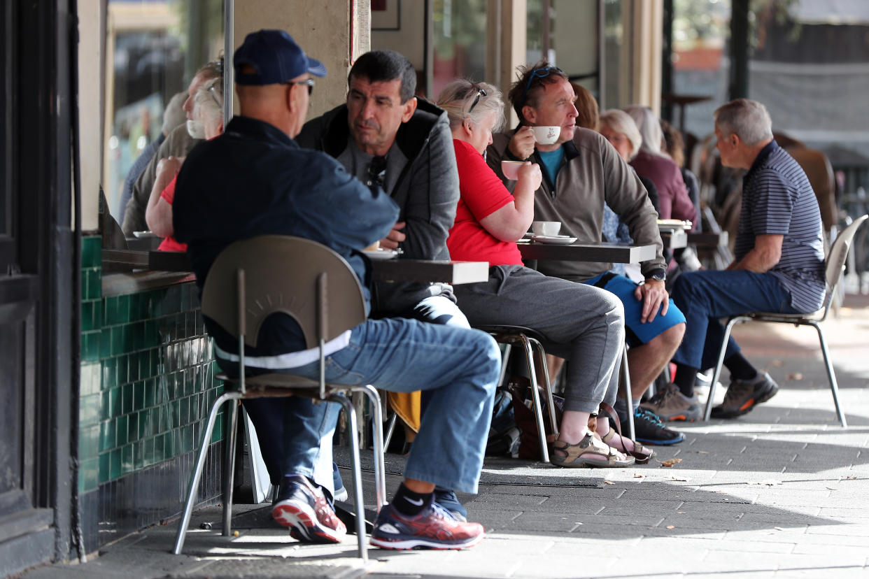 FREMANTLE, AUSTRALIA - MAY 18: Customers are seen at Gino's Cafe on May 18, 2020 in Fremantle, Australia. COVID-19 restrictions have further eased across Western Australia in response to the state's declining infection rate. From Monday 18 May, restaurants and cafes can open for up to 20 patrons to dine in, while indoor and outdoor gatherings of up to 20 people are also permitted. Regional travel boundaries have also been eased, with temporary regional borders reduced from 13 to four. Travel is permitted within the Mid-West, Gascoyne and Pilbara, the Goldfields-Esperance region and within the Kimberley. While travel between South West, Great Southern, Wheatbelt and Peel regions to Perth is also now permitted. Travel between Perth and the other regions remains prohibited, and Western Australia's interstate border also remains closed. (Photo by Paul Kane/Getty Images)