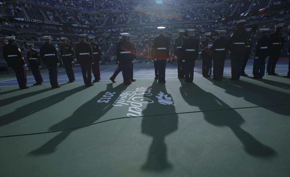 U.S. Marines preside over ceremonies ahead of the men's singles final match between Nadal of Spain and Djokovic of Serbia at the U.S. Open tennis championships in New York