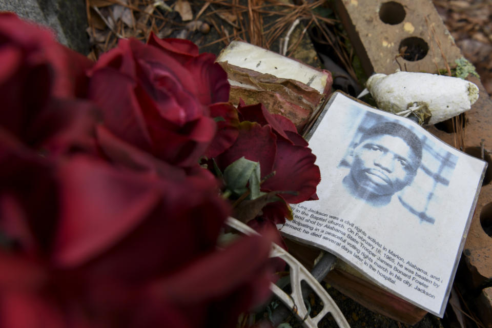FILE - Wreaths and mementos adorn the grave of Jimmie Lee Jackson at Heard Cemetery in Marion, Ala., Feb. 16, 2020. Deacon Jackson had come to protects his grandfather and was fatally shot by a state trooper on Feb. 18, 1965. Andrew Young, one of the last surviving members of Martin Luther King Jr.'s inner circle, recalled the journey to the signing of the Voting Rights Act as an arduous one, often marked by violence and bloodshed. (AP Photo/Julie Bennett, File)