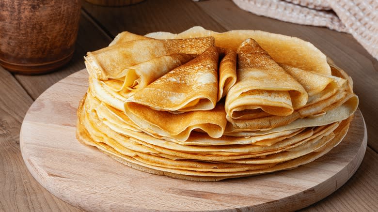 stacked crepes on circular board 