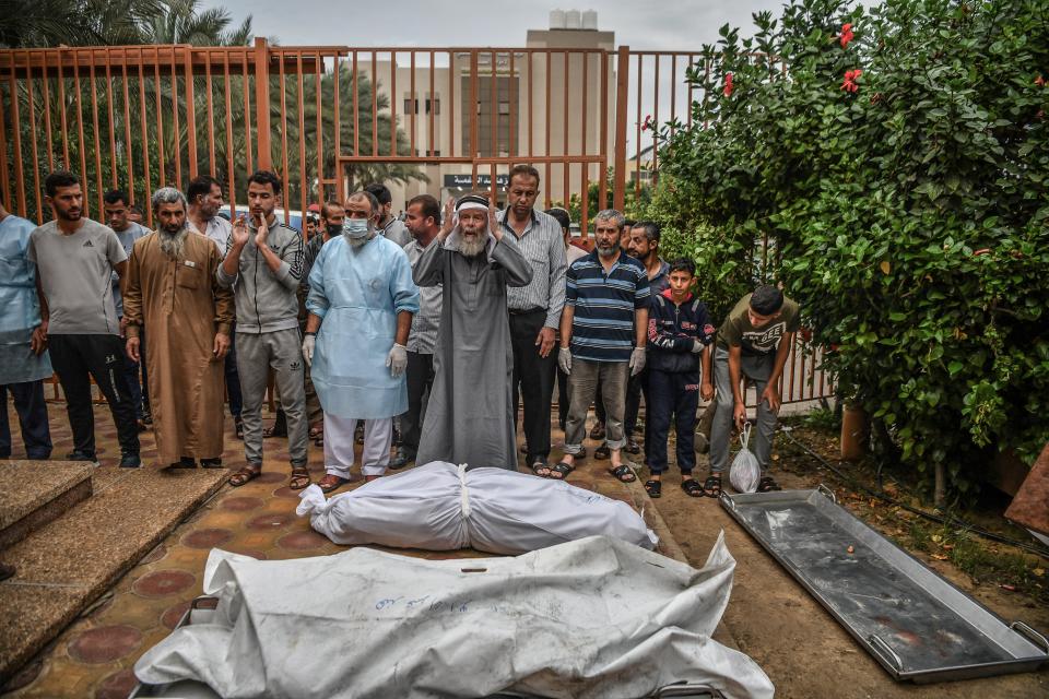 Palestinians perform funeral prayer for the deceased at the courtyard of Nasser Hospital (Anadolu via Getty Images)