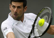 Serbia's Novak Djokovic plays a return to South Africa's Kevin Anderson during the men's singles second round match on day three of the Wimbledon Tennis Championships in London, Wednesday June 30, 2021. (AP Photo/Alastair Grant)
