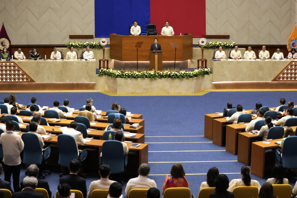 Japan's Prime Minister Fumio Kishida, center, delivers his speech, the first for a Japanese premier to address a special joint session of the Philippine congress, at the House of Representative in Quezon city, Philippines on Saturday, Nov. 4, 2023. The leaders of Japan and the Philippines agreed Friday to start negotiations for a key defense pact that would allow their troops to enter each other's territory for joint military exercises. (AP Photo/Aaron Favila, Pool)