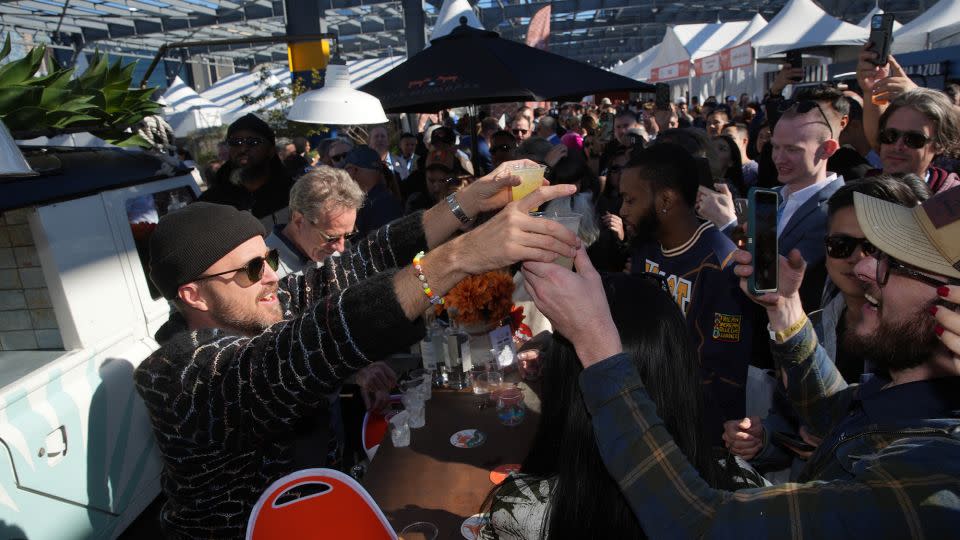 Aaron Paul and Bryan Cranston serve Dos Hombres Mezcal at the Food Network New York City Wine and Food Festival in 2023. - Rob Kim/Getty Images for NYCWFF