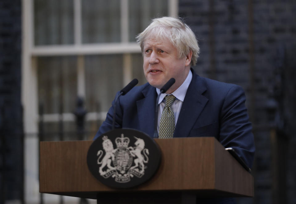 Britain's Prime Minister Boris Johnson speaks outside 10 Downing Street in London on Friday, Dec. 13, 2019. Boris Johnson's gamble on early elections paid off as voters gave the UK prime minister a commanding majority to take the country out of the European Union by the end of January, a decisive result after more than three years of stalemate over Brexit. (AP Photo/Matt Dunham)