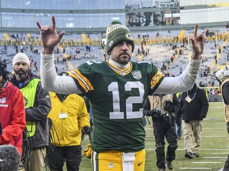 Dec 9, 2018; Green Bay, WI, USA; Green Bay Packers quarterback Aaron Rodgers (12) walks off the field after the Packers beat the Atlanta Falcons at Lambeau Field. Mandatory Credit: Benny Sieu-USA TODAY Sports