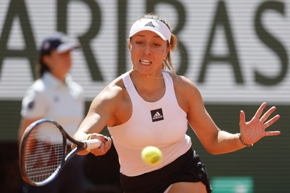 Jessica Pegula of the U.S. returns the ball to Poland's Iga Swiatek during their quarterfinal match of the French Open tennis tournament at the Roland Garros stadium Wednesday, June 1, 2022 in Paris. (AP Photo/Jean-Francois Badias)