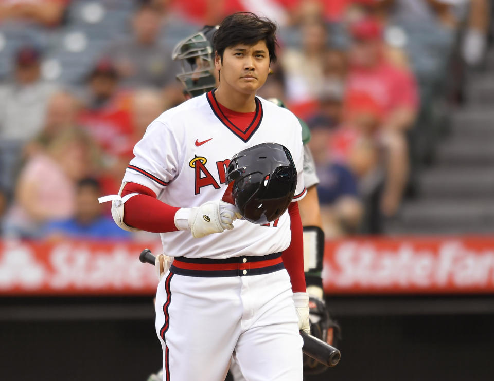 Los Angeles Angels' Shohei Ohtani walks to the dugout after striking out during the first inning of the team's baseball game against Oakland Athletics on Friday, July 30, 2021, in Anaheim, Calif. (AP Photo/John McCoy)