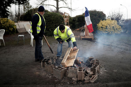 FILE PHOTO: Yellow vests movement members occupy a roundabout in Nemours, France, January 9, 2019. Picture taken January 9, 2019. REUTERS/Benoit Tessier/File Photo