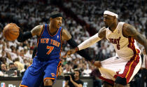 MIAMI, FL - APRIL 28: Forward Carmelo Anthony #7 (L) of the New York Knicks is defended by Forward LeBron James #6 of the Miami Heat in Game One of the Eastern Conference Quarterfinals in the 2012 NBA Playoffs on April 28, 2012 at the American Airines Arena in Miami, Florida. NOTE TO USER: User expressly acknowledges and agrees that, by downloading and or using this photograph, User is consenting to the terms and conditions of the Getty Images License Agreement. (Photo by Marc Serota/Getty Images)