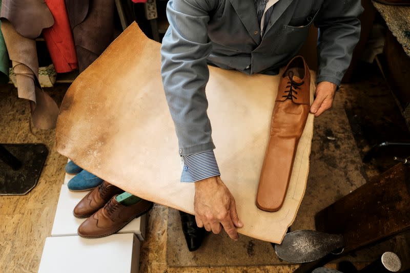 Romanian shoemaker Grigore Lup works on a pair of long-nosed leather shoes, amid the outbreak of the coronavirus disease (COVID-19), in Cluj-Napoca