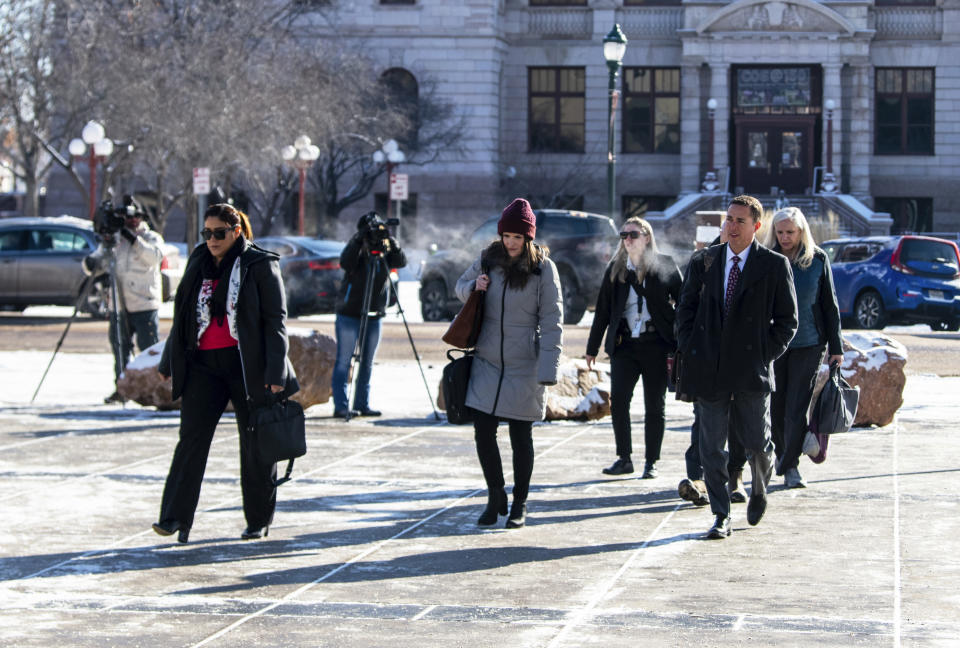 Michael J. Allen, front right, district attorney for Colorado's Fourth Judicial District, enters the El Paso County courthouse for the second and final day of a preliminary hearing for the alleged shooter in the Club Q mass shooting Thursday, Feb. 23, 2023, in Colorado Springs, Colo. (Parker Seibold /The Gazette via AP)