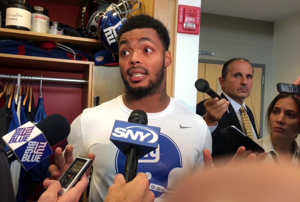 New York Giants linebacker Jonathan Casillas speaks Thursday, Sept. 28, 2017, in the NFL football team's locker room in East Rutherford, N.J., about a meeting with Commissioner Roger Goodell. Goodell held a round-table meeting with roughly 25 owners, league executives and players on Tuesday, Sept. 26, 2017, to discuss the national anthem demonstrations. (AP Photo/Tom Canavan)