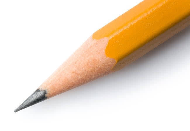 The tip of a sharpened yellow pencil lead.