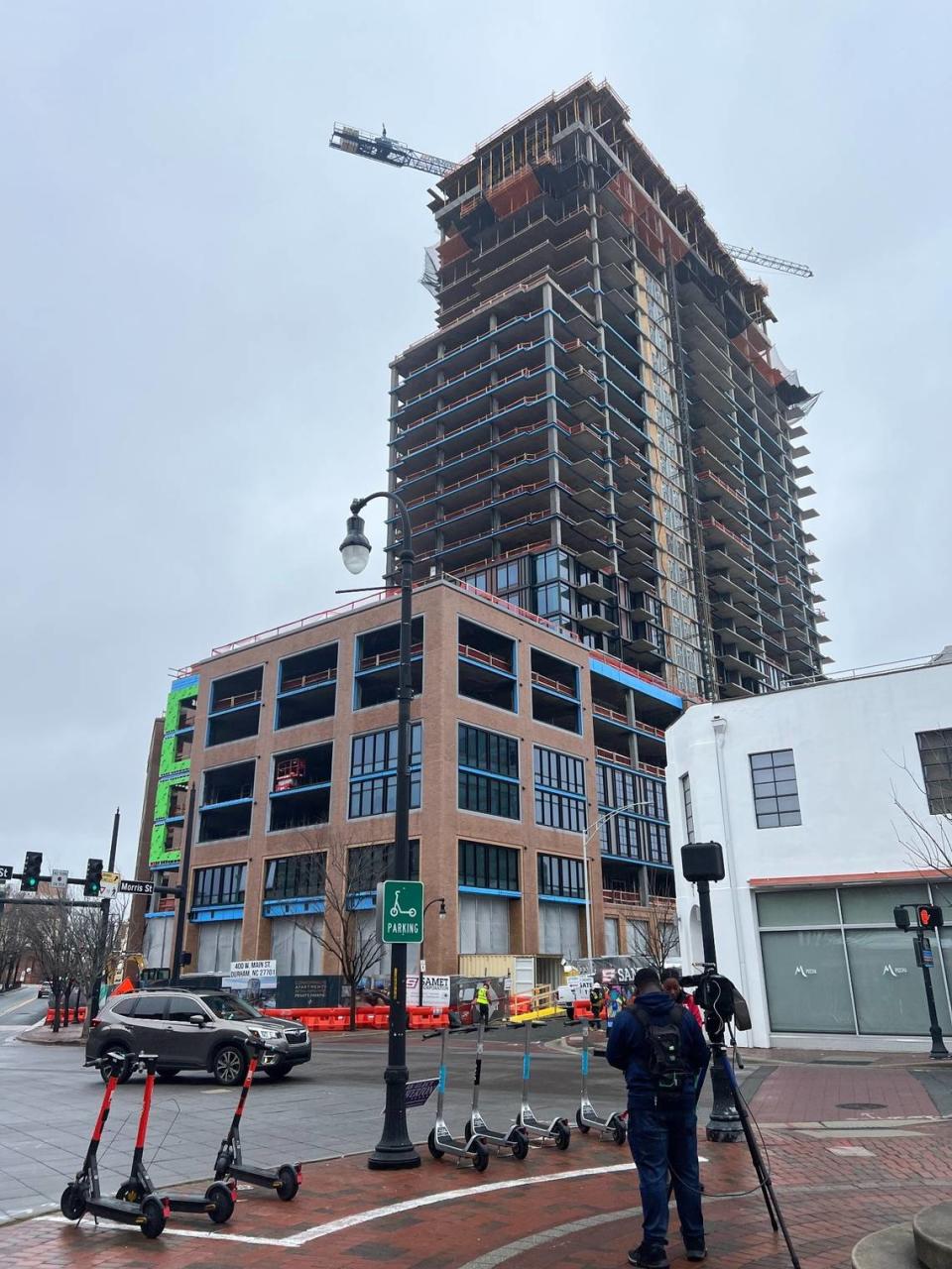 Construction crews completed the final floor of The Novus this week, the high-rise development at 400 W. Main Street in the Five Points district.