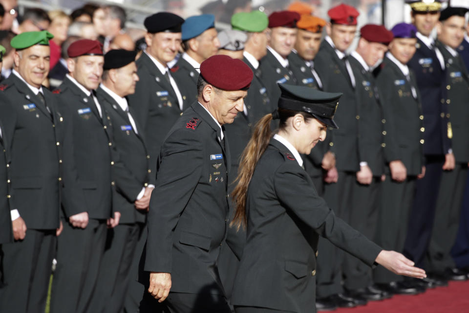 New Israeli Chief of Staff Lt. Gen. Aviv Kochavi, center left, reviews an honor guard in Tel Aviv, Israel, Tuesday, Jan. 15, 2019. Kochavi pledged Tuesday to lead a "lethal, efficient and innovative army" as it faces what he said were grave challenges along its borders. (AP Photo/Ariel Schalit)