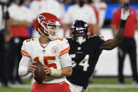 Kansas City Chiefs quarterback Patrick Mahomes (15) looks to pass under pressure from Baltimore Ravens linebacker Tyus Bowser (54) during the second half of an NFL football game, Monday, Sept. 28, 2020, in Baltimore. (AP Photo/Nick Wass)