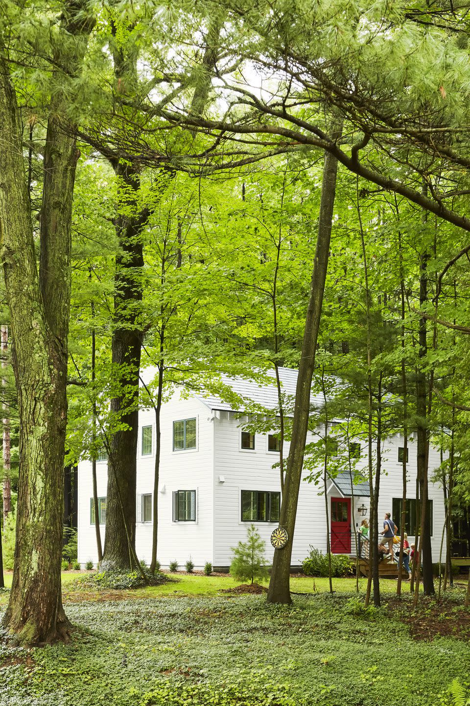 white farmhouse with red door