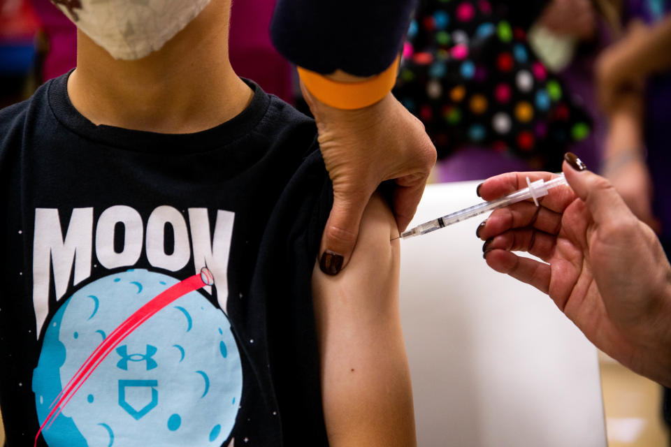 Henry Brandsen gets his first dose of the Pfizer Covid-19 vaccine during a clinic hosted by the Ottawa Department of Public Health Wednesday, Nov. 17, 2021, at Holland West Middle School. 