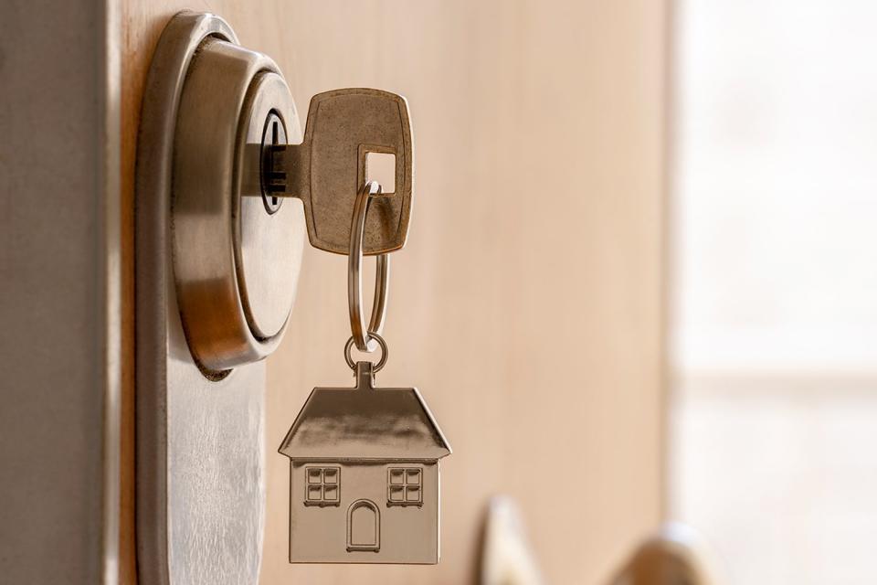 <p>Getty</p> Close-up shot of a key to a vacation rental.