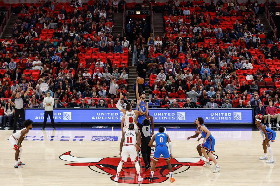 Oct 25, 2023; Chicago, Illinois, USA; Oklahoma City Thunder forward Chet Holmgren (7) wins a tip-off against Chicago Bulls center Nikola Vucevic (9) during the first half of a basketball game at United Center. Mandatory Credit: Kamil Krzaczynski-USA TODAY Sports