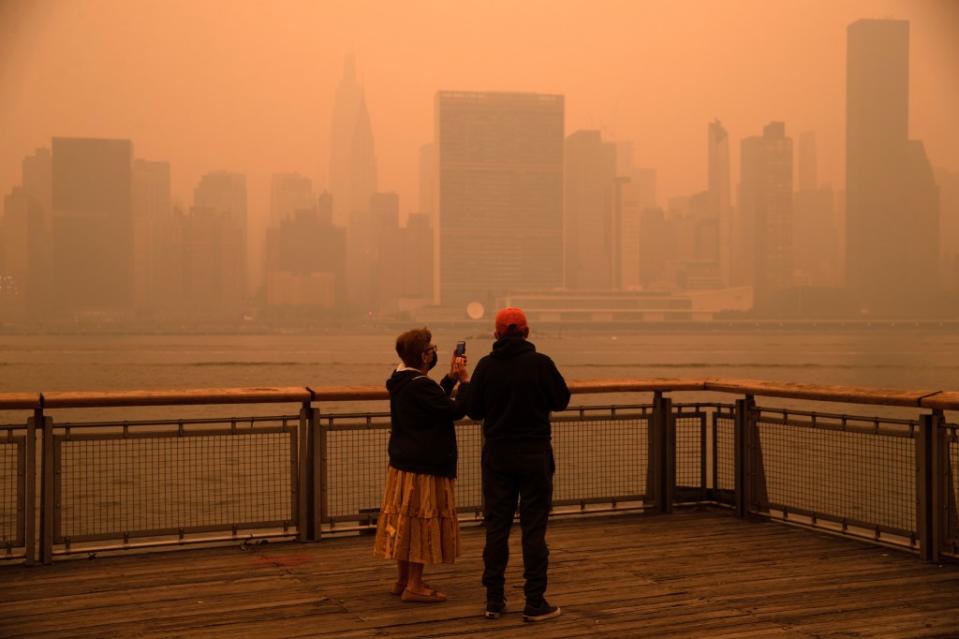 The New York City Manhattan skyline as seen from the East River in Long Island City covered in haze and smoke caused by wildfires in Canada. Brian Zak/NY Post