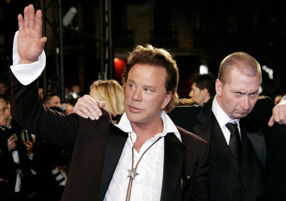 US actor Rourke and director Miller pose during red carpet arrivals for "Sin City" at the 58th Cannes Film Festival. U.S. actor Mickey Rourke (L) and director Frank Miller pose during red carpet arrivals for the in-competition Robert Rodriguez/Frank Miller film "Sin City" at the 58th Cannes Film Festival May 18, 2005. REUTERS/John Schults