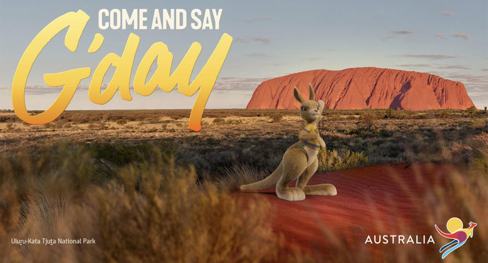 Ruby the kangaroo stands in front of Uluru in a new ad for Tourism Australia