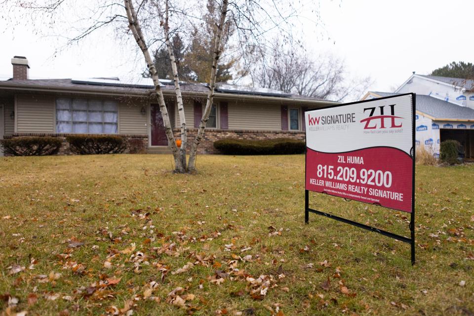 A for-sale sign sits in the yard of 5762 La Cresta Drive, on Dec. 22, 2023, in Rockford.
