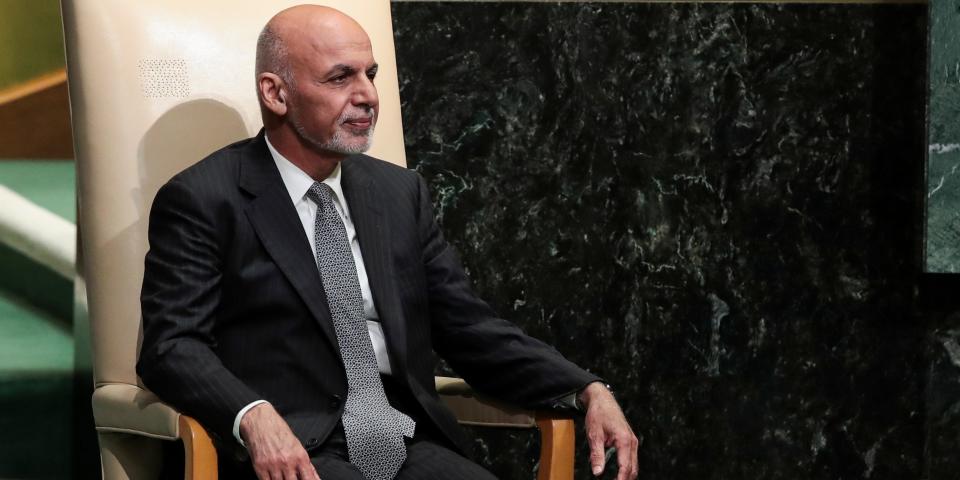 Ashraf Ghani seated in a white chair